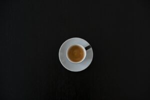 White Ceramic Coffee Cup on White Saucer